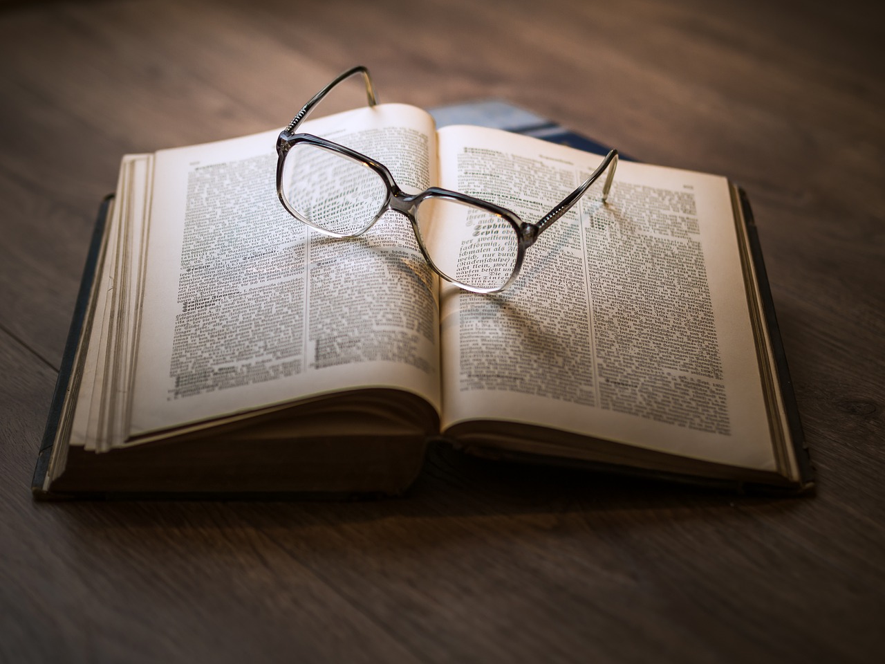 Photo of book and glasses