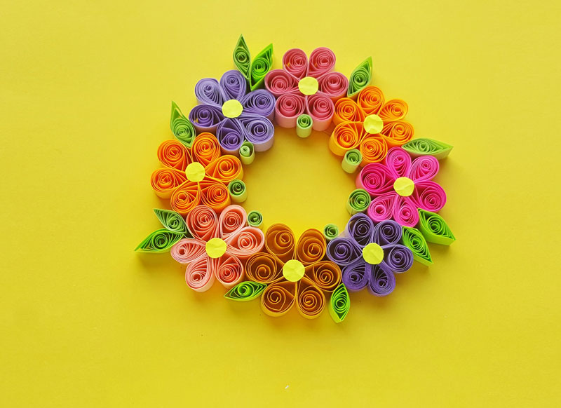 Photo of Paper Quilling Wreath on yellow background