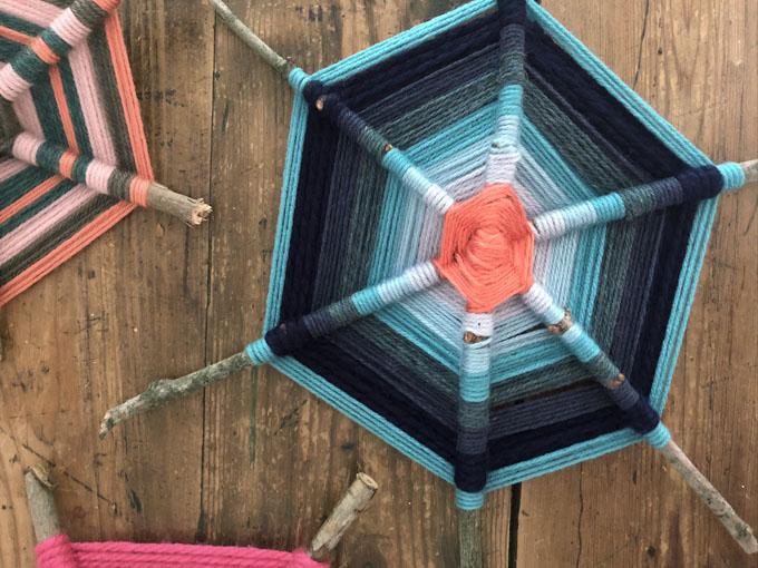 colorful yarn wrapped around twigs